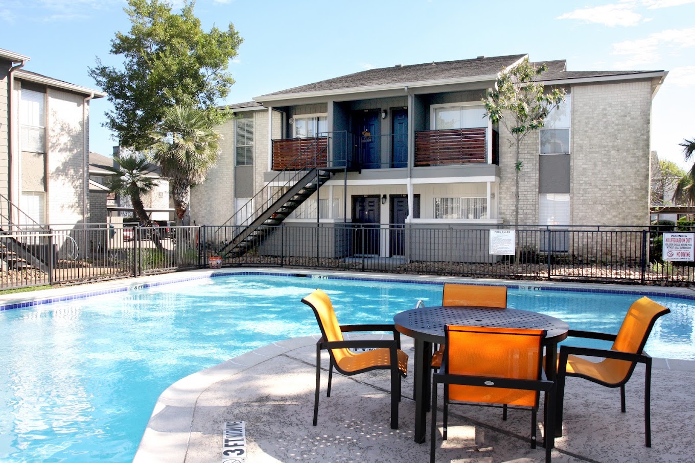 Apartment community pool and seating area