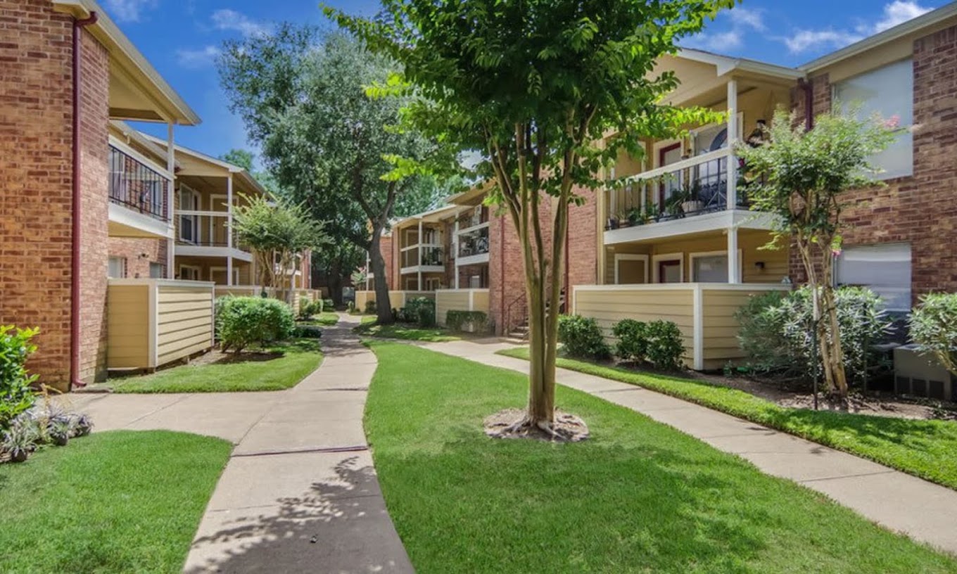 Apartment community walkway and landscaped grounds