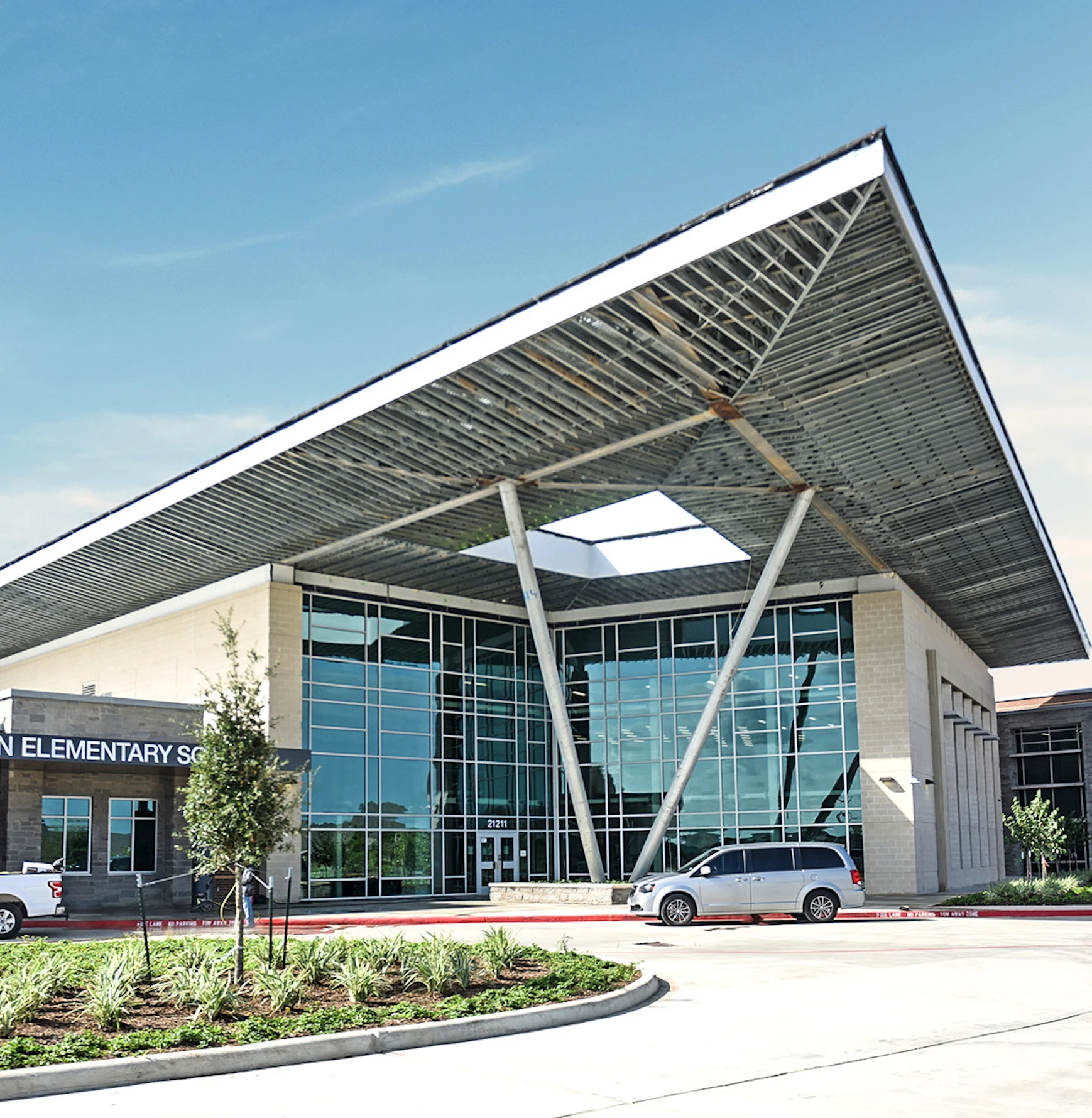 Elementary school building with cantilevered canopy entrance